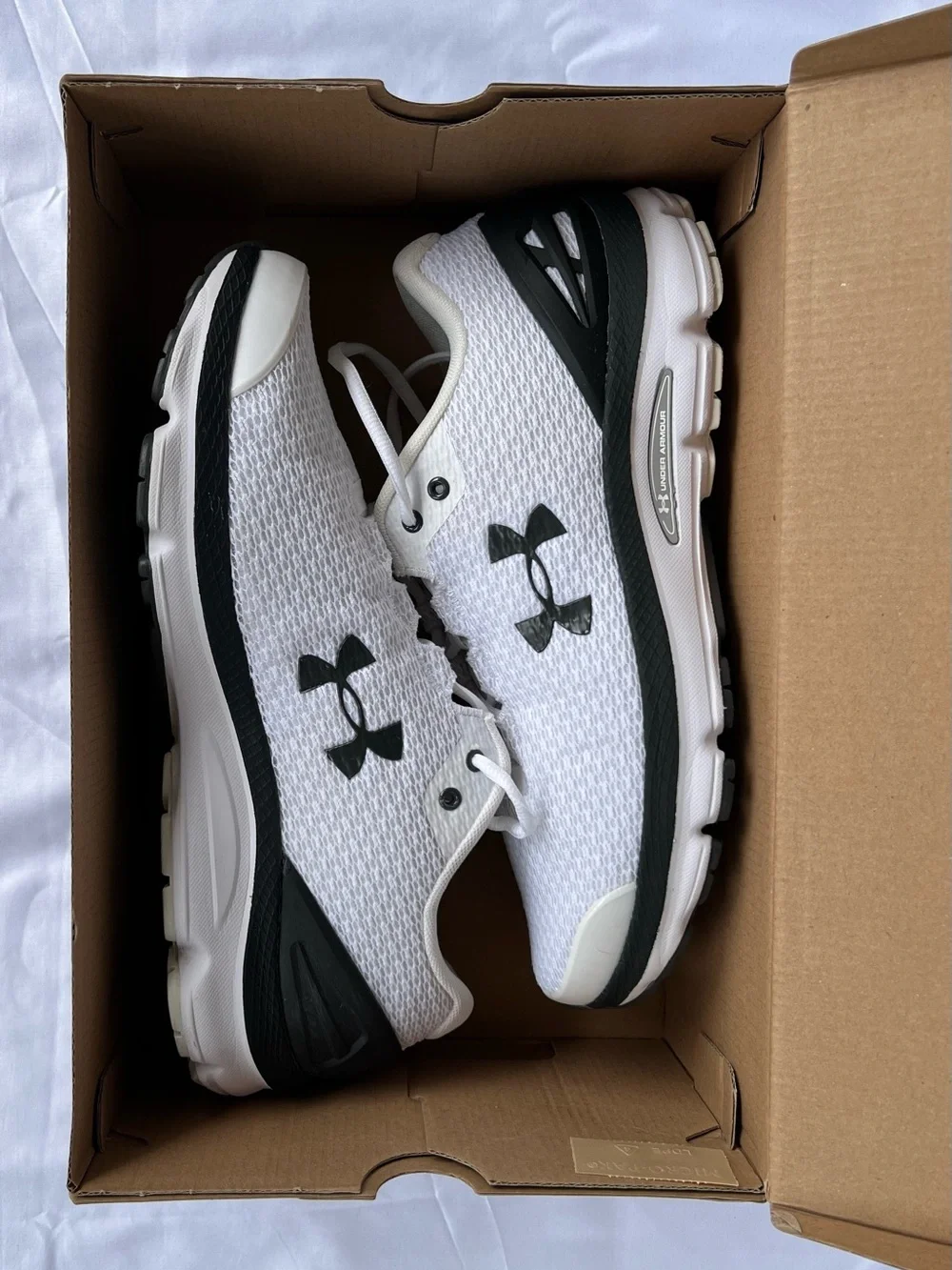 Under Armour (UA Charged Gemini) Mens White and Black Athletic Sneakers